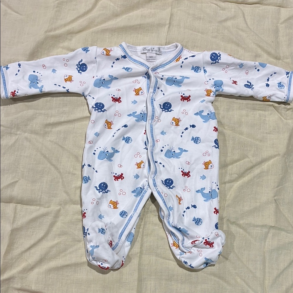 Kissy Kissy newborn one piece snap outfit with sea creatures design.